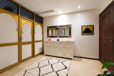 a dressing room with a dresser and a mirror at Gueliz family Express in Marrakech