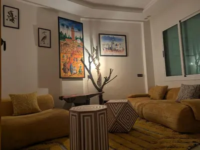 a living room with two couches and a table at Gueliz family Express in Marrakech