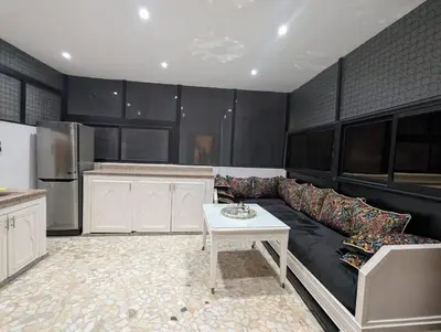 a living room with a couch and a table at Gueliz family Express in Marrakech
