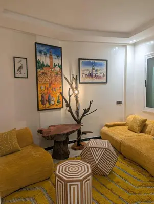 a living room with a couch and a table at Gueliz family Express in Marrakech