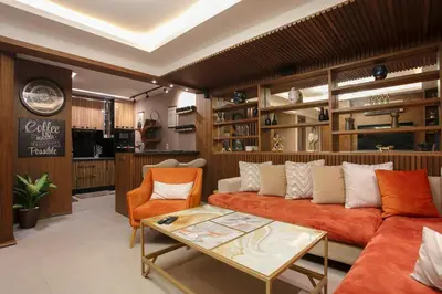 a living room with a couch and a table at The Modern Luxury - Marrakech in Marrakech
