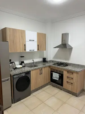 a kitchen with a sink and a dishwasher at Apartment piscine gueliz hivernage ctm train aeroport supratour in Marrakech