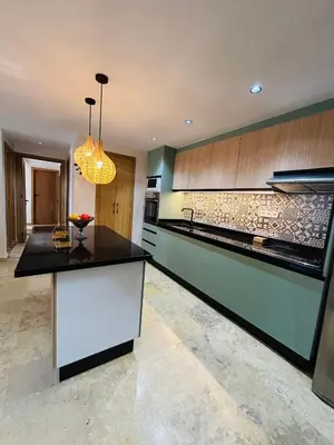 a kitchen with a black counter top and a sink at Appartement marrakech in Marrakech