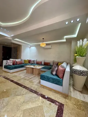 a living room with two couches and a table at Appartement marrakech in Marrakech