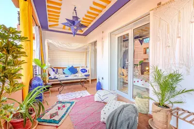 a living room filled with lots of plants at Boho chic retreat in Marrakech