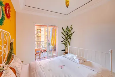 a bedroom with a bed and a window at Boho chic retreat in Marrakech
