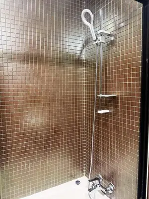 a bathroom with a shower with a sink at Beautiful apartment in a very good location and free parking in Marrakech