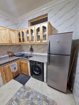 a kitchen with a refrigerator and a dishwasher at Apartment in Marrakech , Near Jamaa El Fna in Marrakech