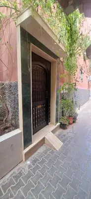 a entrance to a building with a black gate at Apartment in Marrakech , Near Jamaa El Fna in Marrakech