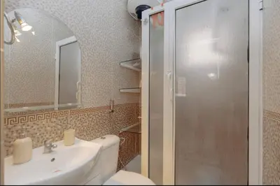 a bathroom with a toilet and a sink and a shower at Maison Marocaine de Farah in Marrakech