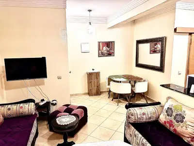 a living room with a couch and a table at Maison Marocaine de Farah in Marrakech