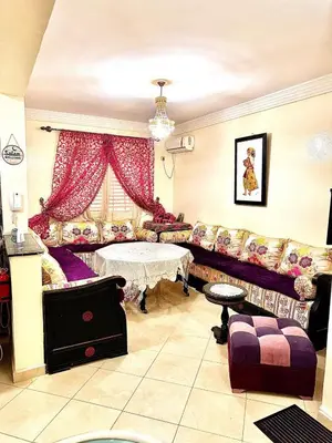 a living room with a couch and a table at Maison Marocaine de Farah in Marrakech