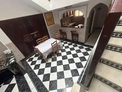 an aerial view of a bedroom with a checkered floor at Riad& 4 Chambres Avec La piscine in Marrakech