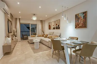 a living room with a couch and a table at Premium stay in Guéliz-Hivernage in Marrakech