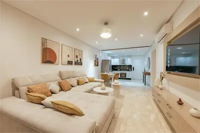 a large white living room with a large couch at Premium stay in Guéliz-Hivernage in Marrakech