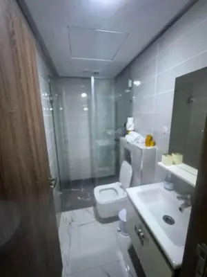 a bathroom with a toilet and a sink and a shower at Feels like home in Marrakech