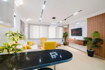 a living room with a couch and a tv at Apartment in Center of Marrakech in Marrakech