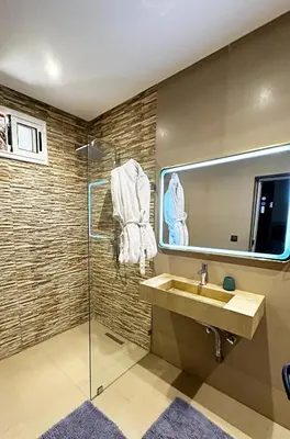 a bathroom with a sink and a mirror at Marrakech Escape Your Private Villa in Marrakech
