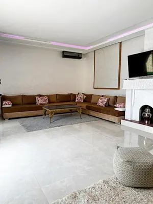 a living room with a couch and a fireplace at Marrakech Escape Your Private Villa in Marrakech