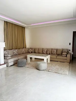 a living room with a couch and a table at Marrakech Escape Your Private Villa in Marrakech
