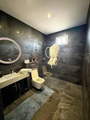 a bathroom with a toilet and a sink at Marrakech Escape Your Private Villa in Marrakech