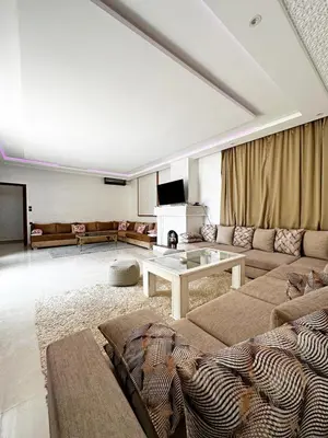 a living room with a couch and a table at Marrakech Escape Your Private Villa in Marrakech