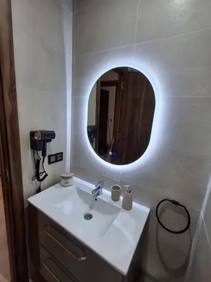 a bathroom with a sink and a mirror at Appartement a hivernage in Marrakech