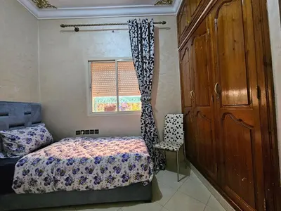 a bedroom with a bed and a window at Residencia Salma in Marrakech