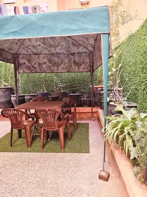 a gazebo with a table and chairs under it at Residencia Salma in Marrakech