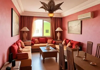 a living room with a couch and a table at Appart AMITAF in Marrakech