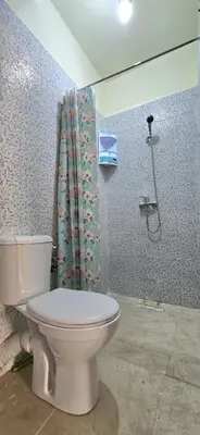a bathroom with a toilet and a shower at Nice apart well located 2 Rooms -Only Family in Marrakech