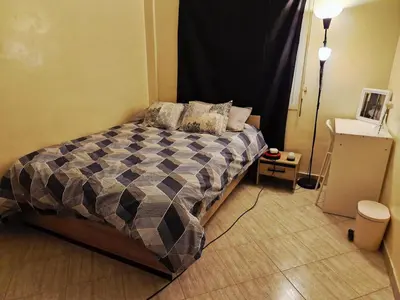 a bedroom with a large bed in a room at cozy appartement in Marrakech