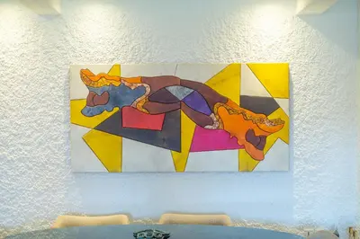 a painting of a horse on a wall at Stylish 2BR With Balcony & Designer Touches in Gueliz in Marrakech