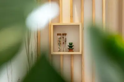a white shelf on a wall with a vase on it at Marrakech Oasis, Central and Modern in Marrakech