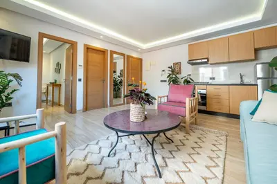 a living room with a couch and a table at Marrakech Oasis, Central and Modern in Marrakech