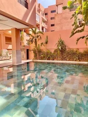a swimming pool in the middle of a building at Very comfortable apartment in a perfect location in Marrakech