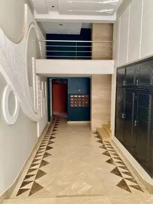 a hallway of a building with a staircase and a hallwayngth at Very comfortable apartment in a perfect location in Marrakech