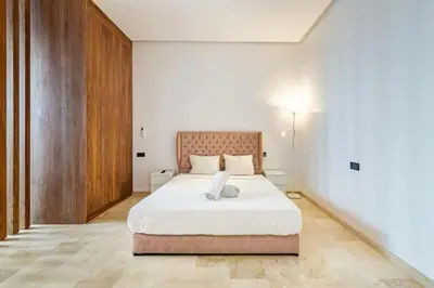 a bedroom with a large white bed in a room at Villa marrakech in Marrakech