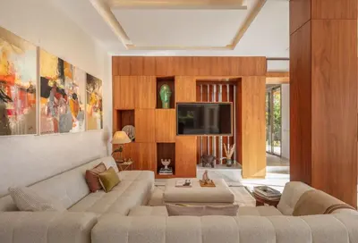a living room with a couch and a tv at Villa Dar Saliha in Ala el Ma