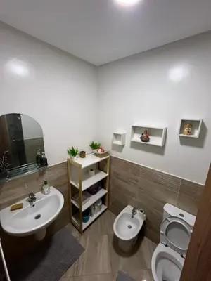 a bathroom with a sink and a toilet at jnane awrad du 18 novembre in Marrakech