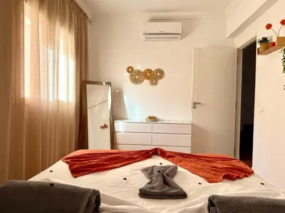 a bedroom with a bed with a costume on it at Le Cosy Nejmaa - Piscine - 4 Prs - Marrakech in Marrakech