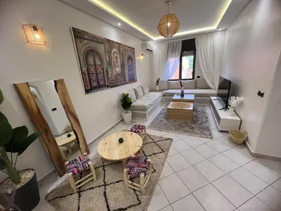 a living room with a couch and a table at Cozy appartement au centre de marrakech in Marrakech