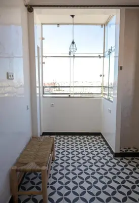 a room with a bench and a large window at Marjane Allal Fassi 2 chambres Bedrooms 2 Bathrooms Wi-Fi fibre climatisation in Marrakech