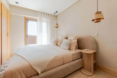 a bedroom with a bed and a window at Penthouse with Rooftop and Jardin Majorelle View in Marrakech