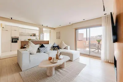 a living room with a couch and a table at Penthouse with Rooftop and Jardin Majorelle View in Marrakech