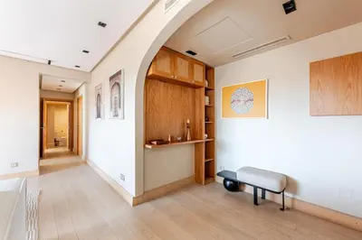 an arched hallway with a bench in a room at Penthouse with Rooftop and Jardin Majorelle View in Marrakech