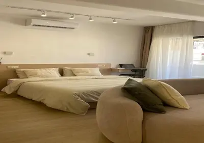 a bedroom with a large bed and a couch at havre de paix in Marrakech