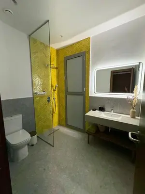 a bathroom with a toilet and a sink and a shower at Imagine Villa in Marrakech