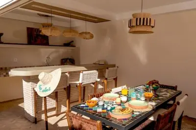 a dining room with a table with food on it at Riad DAR ELMA NOI in Marrakech