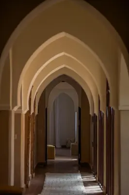 an archway of a hallway in a building at Villa des SONGES in Marrakech